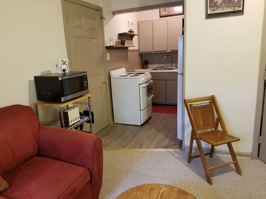 The efficiency kitchen is in adjacent to the living room. All appliances and utensils are included.