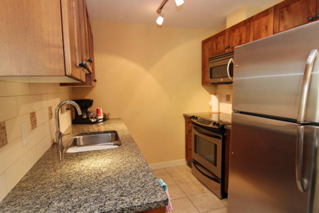 A modern, well-equipped kitchen makes preparing meals convenient