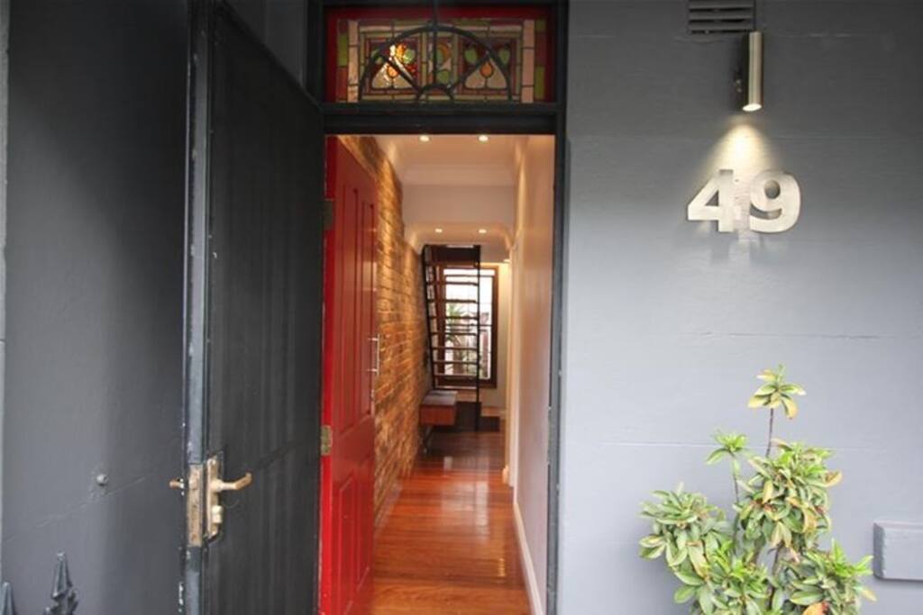 Front entrance, your room is first on the right.