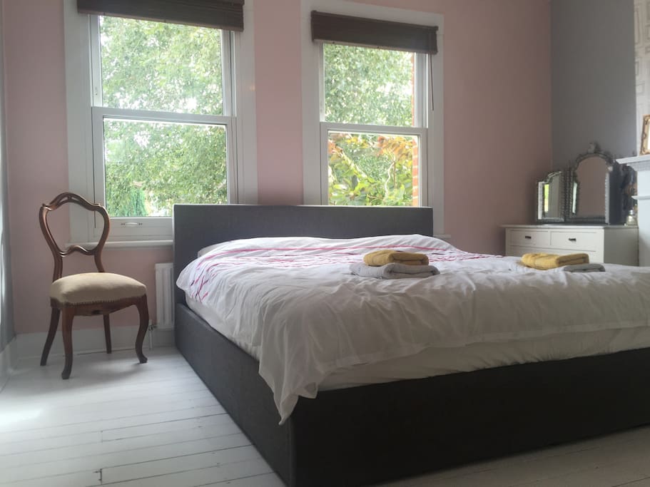 Master bedroom with super kingsize bed and plenty of natural light