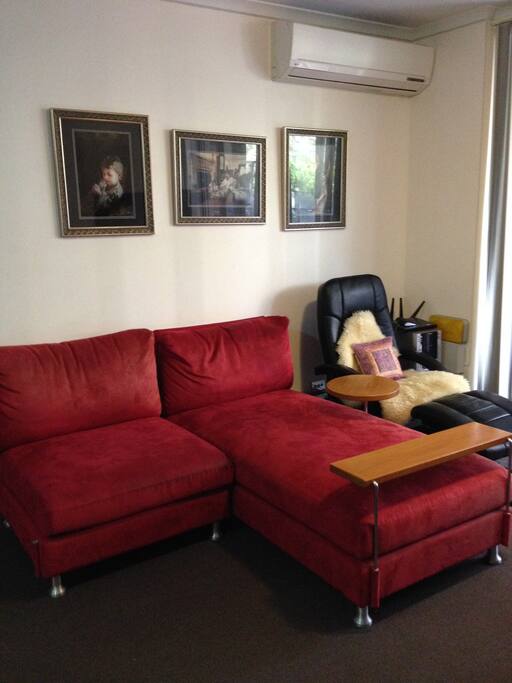 living room with aircon.
Sofa can be a sleeping place.