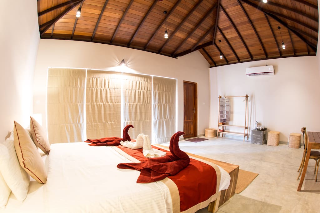 Rooms include a private garden, modern ensuite bathroom, storage space for clothes and extra seating
