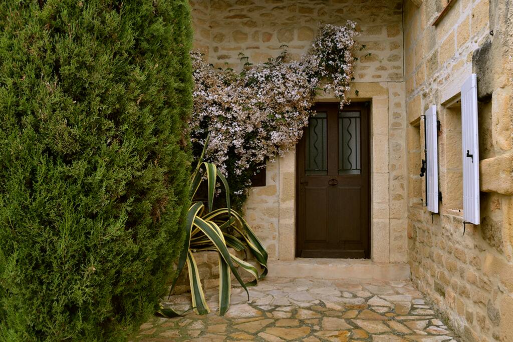 Olive Oil entrance with jasmine blooming in April