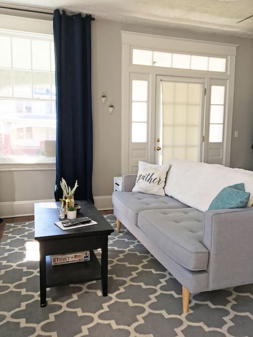 ***We have swapped the living and dining room. The living area was too small - it could barely fit 4 people. We have added a rocking chair, a cute black and white rug and a camel colored leather love seat. The living room now fits 6+ comfortably! Photos to come soon!
