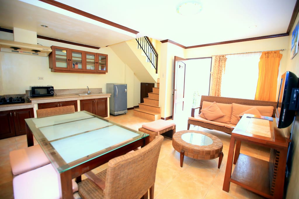 From the dining area, view of the stairs going to the bedroom