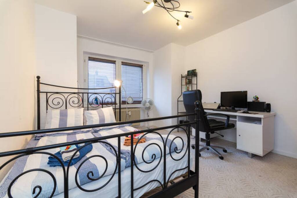 Bedroom with double bed and working space