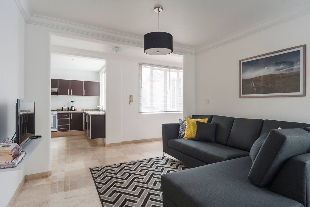 Confortable living area, view of the kitchen.