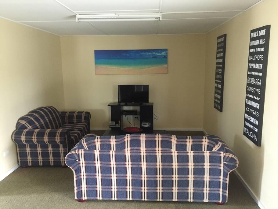 Lounge room which also has an additional lounge not shown in this pic. There is a TV and PlayStation for guest use.