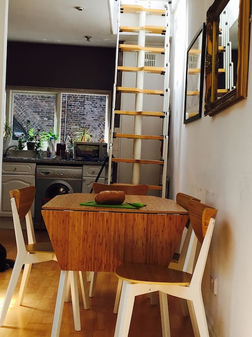 View from living area towards kitchen and stairs to roof terrace.