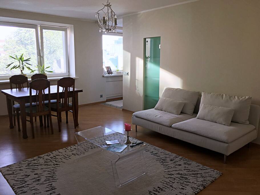 Living room with dining table and entrance to the kitchen