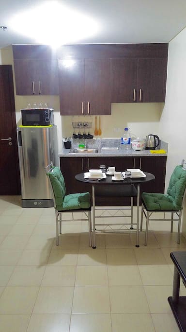 - kitchen equipped with tablewares and utensils, brand new fridge and microwave
