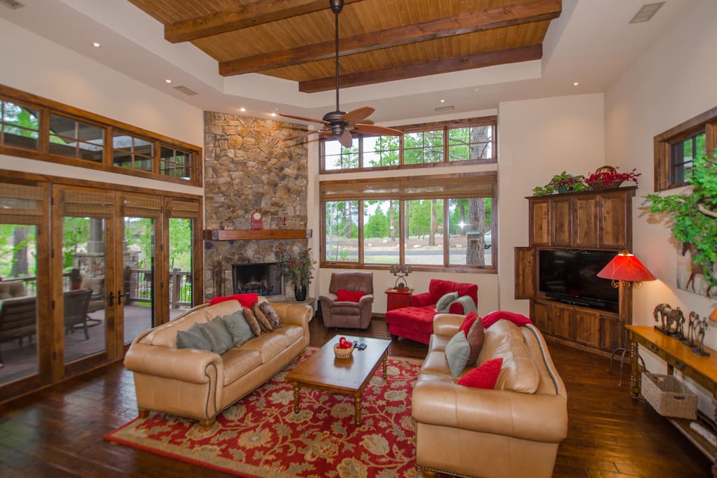Large family room features cozy wood burning fireplace, HDTV w/ TiVO & Netflix.