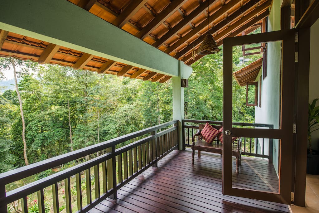 Outdoor wooden verandah with amazing view of the forest.