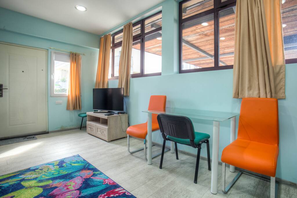 Living Room with Flat Screen TV and Siting Table
