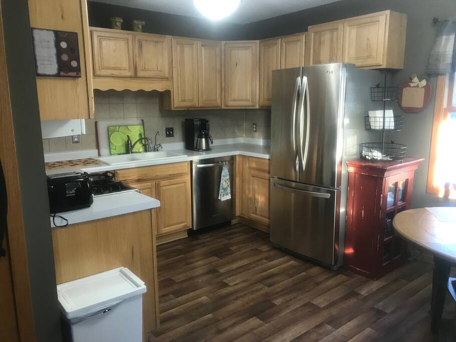 Kitchen with coffee machine and coffee available to use.