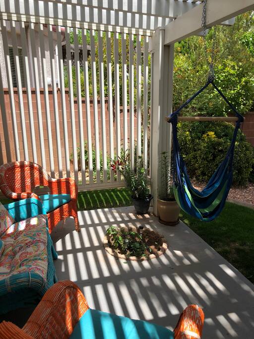 Outdoor seating area with hammock swing
