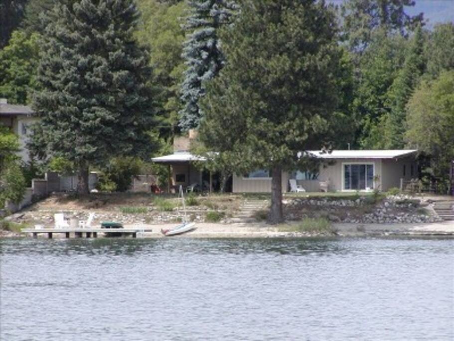 House, beach and dock from the water
