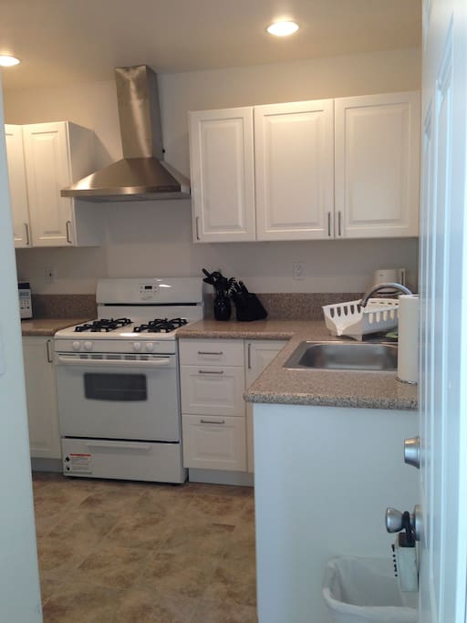 Kitchen, fully stocked with plates and silverware, etc. Stainless fridge