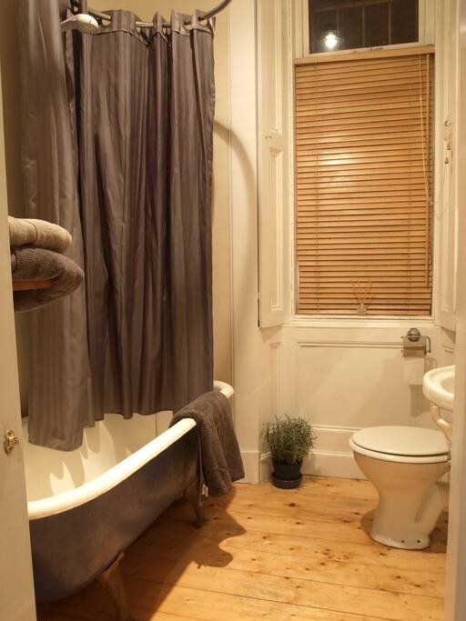 Claw foot roll top bath with electric shower