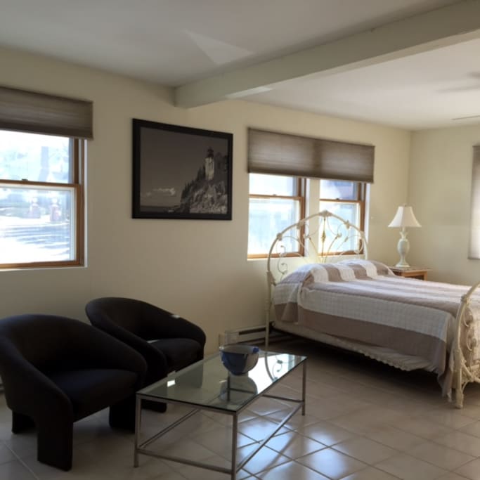 This is the Beachview room Queen Bed, sitting area