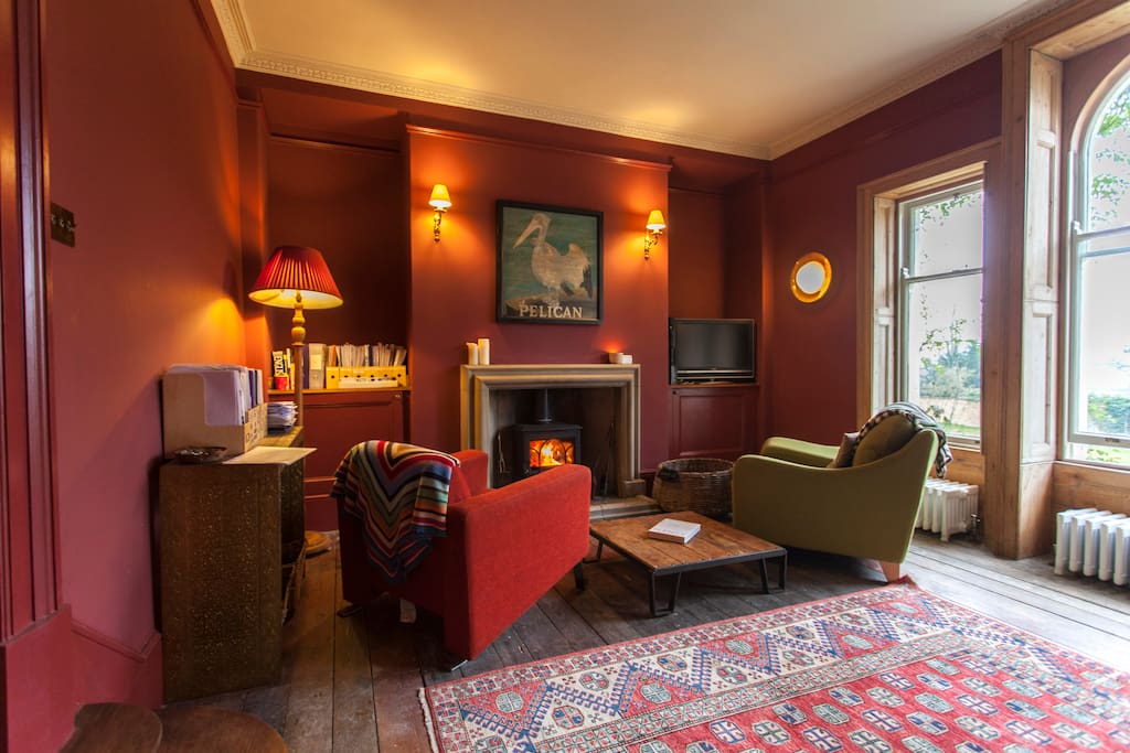 The Red Sitting Room with log fire