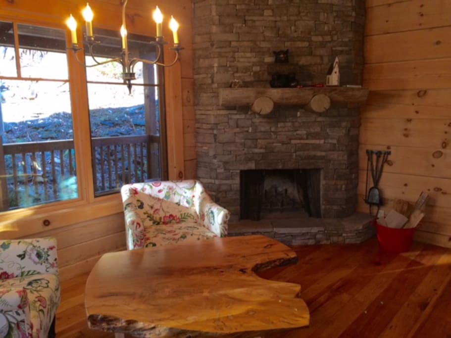 Sitting area with wood-burning fireplace.