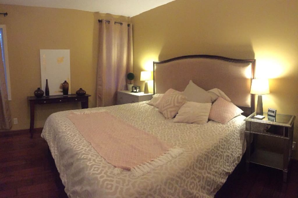 Master bedroom with King size bed, 2 dressers, 2 closets, 1/2 bath connected