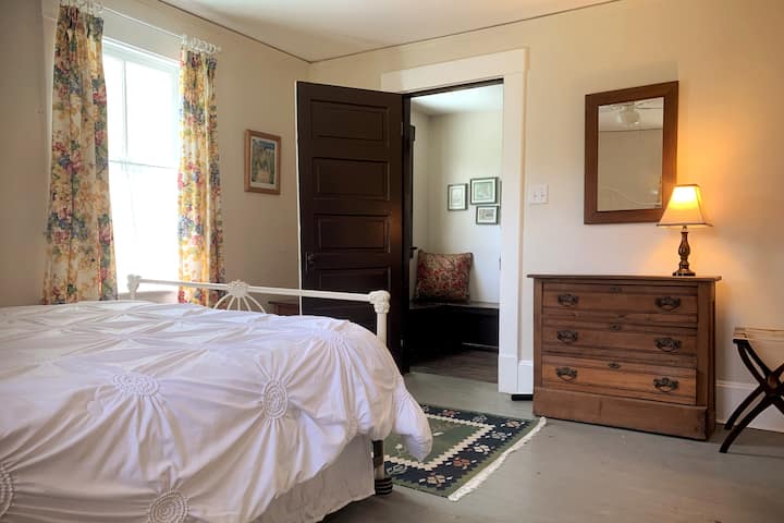 Bedroom 2 has a queen bed and located across the hall from Bedroom 1. A window AC unit was recently added.