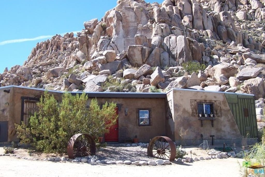 Front view of house on Bobcat Trail. Behind is Joshua Tree NP.