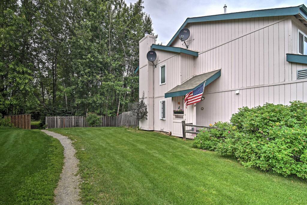 Enjoy the home's spacious backyard with beautiful landscaping!