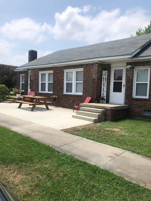 Delightful Corner Cottage, by Janssen Park