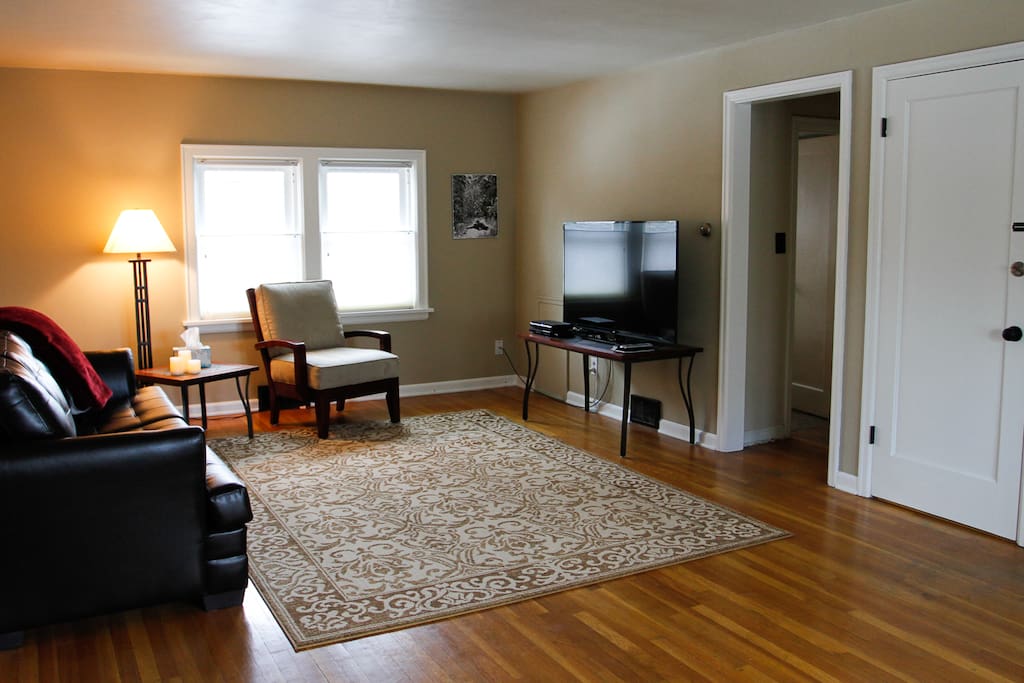 IThe living room features a 55" TV with DVD player and basic cable.