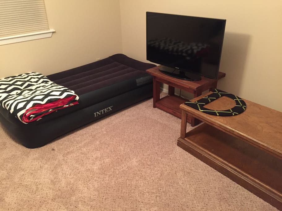 Twin air mattress (sheets, blankets, and pillows provided). TV doesn't have cable but you can watch Netflix.