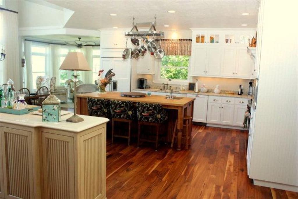 Fully appointed kitchen with high end appliances and beautiful bar and island
