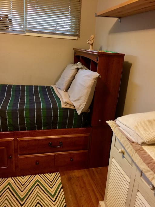 Single bed. Desk in background