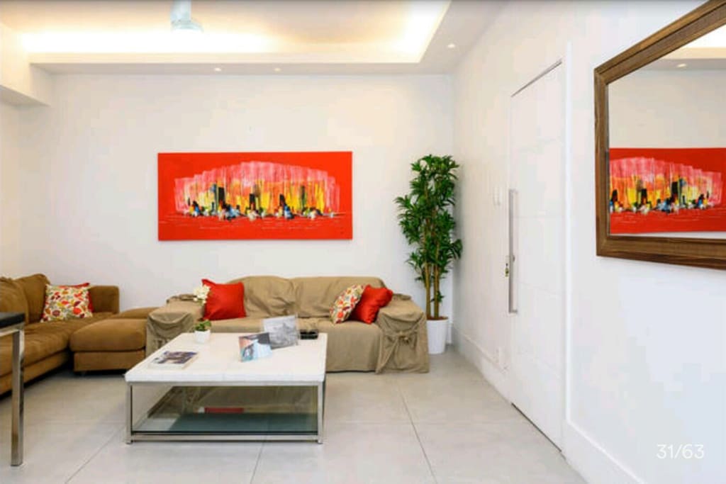 Living room,ceiling fan,flat located just one block from the beach Copacabana othon hotel area beach