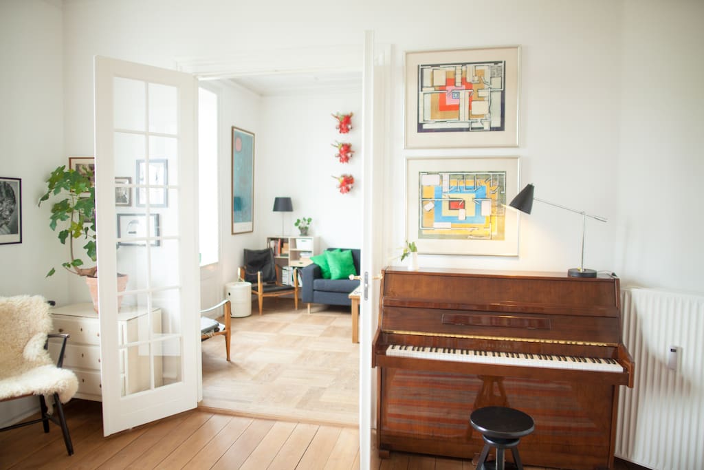 Living room with piano.