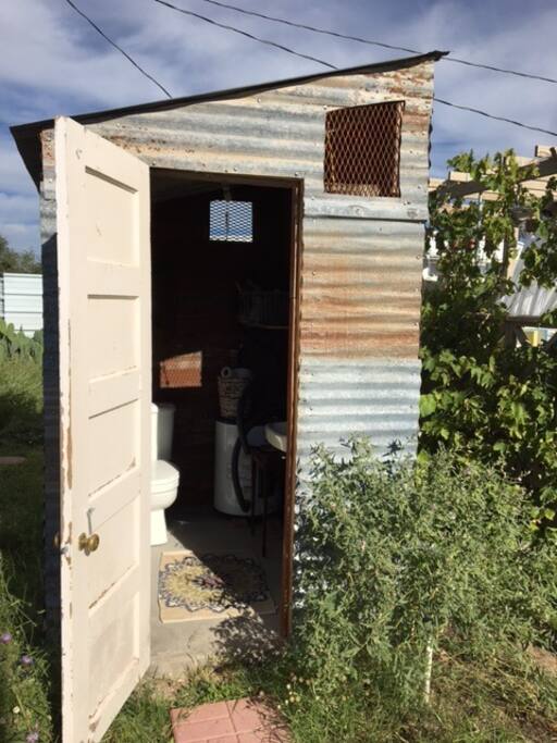 outdoor bathroom with plumbing & hot water