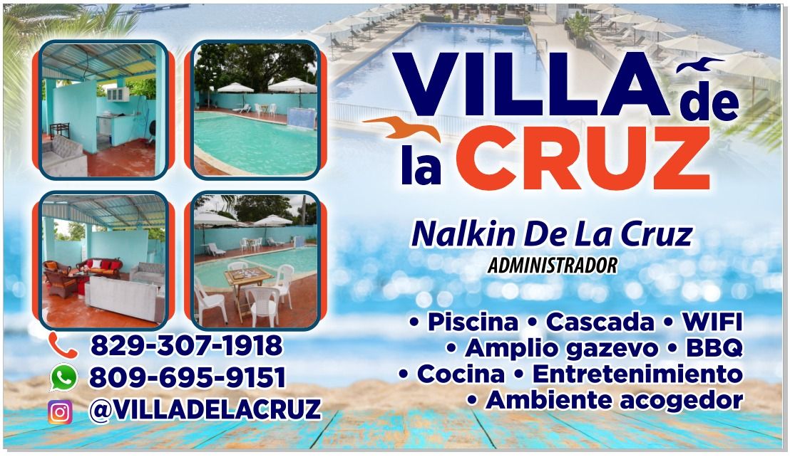 The image features a vibrant pool area surrounded by tropical vegetation, with a cascading waterfall in the background. An open gazebo is visible, providing a shaded space for relaxation. Table and lounge chairs are arranged around the pool, creating a welcoming environment for enjoying the outdoors.