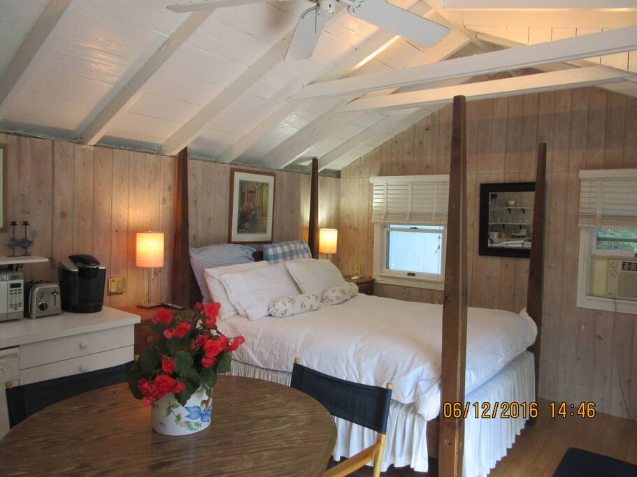 This 4-Poster King Bed w Down Puff helped earn the affectionate nickname for our guest cottage, "Love Shack".
