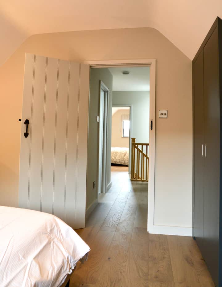 View from the second bedroom into the hallway.