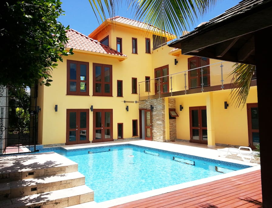 THE HOUSE SEEN FROM THE PRIVATE POOL AND GARDEN