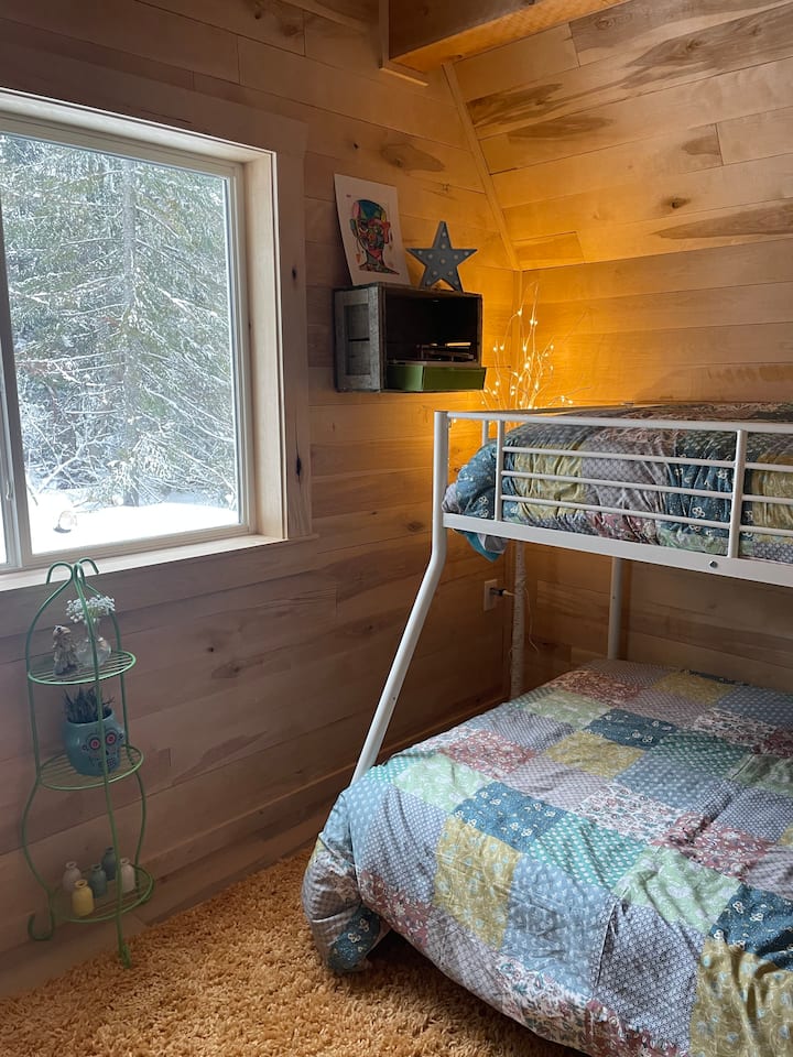 Lower level bedroom with full size bunk, twin size bunk, and a single pull out sleeper chair!! Plus a fun hammock.