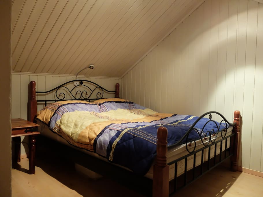 Double bed at the "sleeping corner" in the far end of the loft. Bed size: 150 cm × 200 cm (59 in × 79 in)