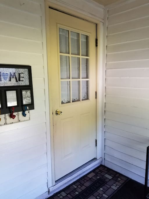 Private back entrance with coat and shoe racks for you convience
