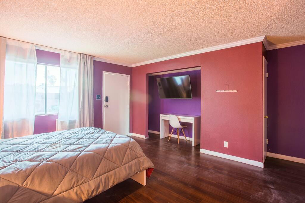 Queen bed with premium mattress, work desk, 49' Roku-Enabled TV.