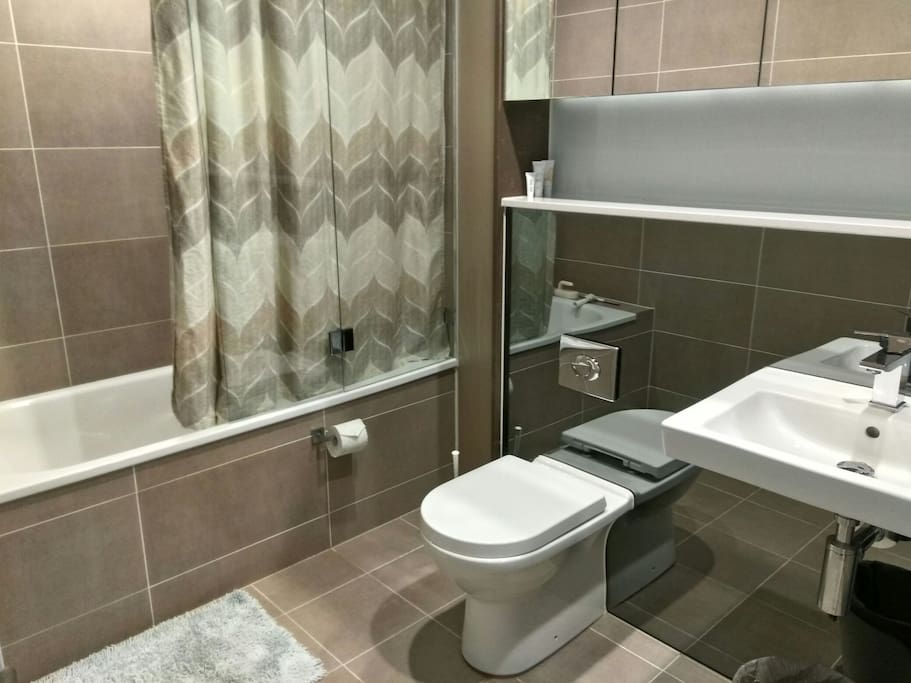 En suite bathroom - equipped with all basic necessities including shampoos, conditioners, body wash, face and hand wash and hair dryer.