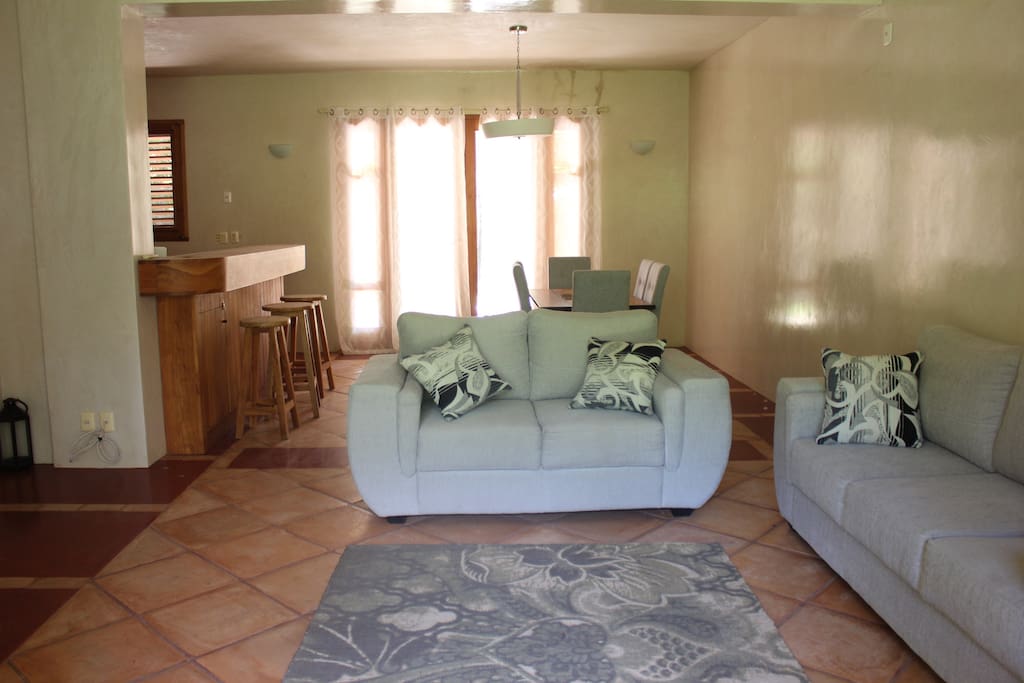 Living room has plenty of comfortable sofas for your entire family as well as full bathroom
