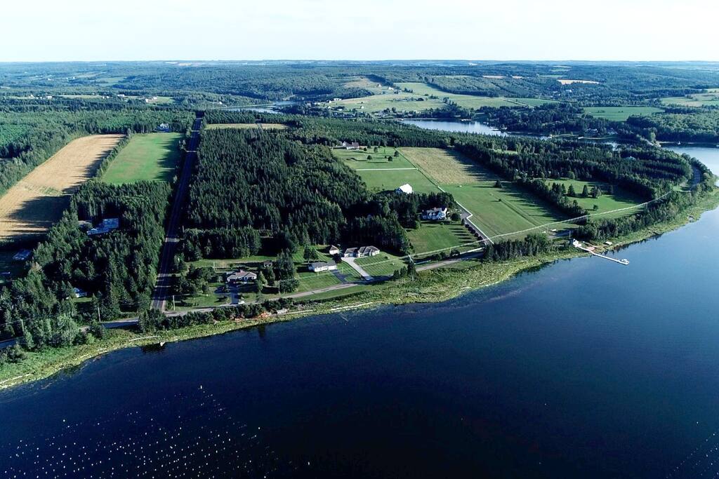 Aerial view showing Stanley River with cottage in background.