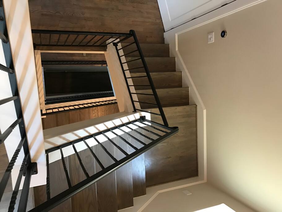 Four floors that lead to a rooftop deck